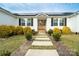 Inviting home with a stone walkway, white siding, solar panels and a well-manicured front yard at 9489 Westridge Dr, Hickory, NC 28601