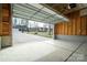 Spacious garage with concrete floor, automatic door, and view of the neighborhood at 9489 Westridge Dr, Hickory, NC 28601