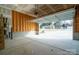 Spacious two-car garage interior with unfinished walls, concrete floor and mechanical door opening system at 9489 Westridge Dr, Hickory, NC 28601