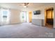 Serene main bedroom featuring plush carpeting, abundant natural light, and walk-in closet at 9489 Westridge Dr, Hickory, NC 28601