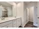 Main bathroom with double vanity, white cabinets, and a walk-in shower at 9859 Old Garden Cir, Gastonia, NC 28056