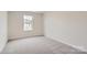 Bright bedroom with neutral walls and carpet at 9859 Old Garden Cir, Gastonia, NC 28056