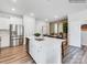 White kitchen island with quartz countertops and stainless steel appliances at 9863 Old Garden Cir, Gastonia, NC 28056