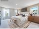 Main bedroom with king bed, light walls, and wood nightstands at 9863 Old Garden Cir, Gastonia, NC 28056