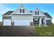 Two-story house with beige siding, stone accents, and a two-car garage at Lot 1 Glenview Meadow Dr # Arcadia, Waxhaw, NC 28173