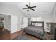 Spacious bedroom with ensuite bathroom access and hardwood floors at 10501 Rougemont Ln, Charlotte, NC 28277