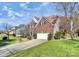 Two-story house with a side view of the driveway and yard at 10501 Rougemont Ln, Charlotte, NC 28277