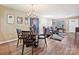 Bright dining area with wood flooring and a charming chandelier at 11023 Alderbrook Ln, Charlotte, NC 28270