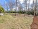 Backyard with grass, trees, and landscaping at 1116 Circlewood Dr, Charlotte, NC 28211