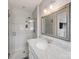 Modern bathroom featuring a glass enclosed shower and vanity with marble countertop at 1116 Circlewood Dr, Charlotte, NC 28211
