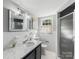 Clean bathroom with a sink, vanity, toilet, and shower with glass doors at 1116 Circlewood Dr, Charlotte, NC 28211