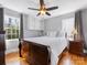 Bedroom with hardwood floors, a ceiling fan and a queen-sized bed at 1116 Circlewood Dr, Charlotte, NC 28211