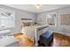 Bedroom featuring a white wooden framed bed and a matching drawers with wooden floors at 1116 Circlewood Dr, Charlotte, NC 28211