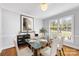 Bright dining room with modern table and chairs with natural light shining through at 1116 Circlewood Dr, Charlotte, NC 28211