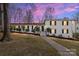 Well-maintained home with landscaping and mature trees at 1116 Circlewood Dr, Charlotte, NC 28211