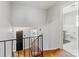 Upstairs hallway with hardwood floors leading to bedroom and bathroom at 1116 Circlewood Dr, Charlotte, NC 28211