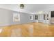 Spacious living room with hardwood floors, built-in shelving, and lots of natural light at 1116 Circlewood Dr, Charlotte, NC 28211