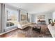 Bright living room with hardwood floors, large windows offering natural light, and comfortable seating at 1116 Circlewood Dr, Charlotte, NC 28211