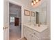 Bathroom with white vanity and view into bedroom at 11756 Easthampton Cir, Charlotte, NC 28277