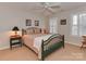 Bedroom with a green metal bed frame and window shutters at 11756 Easthampton Cir, Charlotte, NC 28277