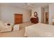 Spacious bedroom with a wooden armoire and comfortable seating at 11756 Easthampton Cir, Charlotte, NC 28277