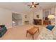 Bright bonus room with vaulted ceiling, comfortable seating area, and home office space at 11756 Easthampton Cir, Charlotte, NC 28277