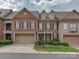 Brick front exterior of charming townhome with two-car garage at 11756 Easthampton Cir, Charlotte, NC 28277