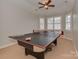 Fun game room, perfect for entertainment, featuring a table tennis table at 11756 Easthampton Cir, Charlotte, NC 28277