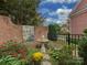 Landscaped garden with birdbath and beautiful flower beds at 11756 Easthampton Cir, Charlotte, NC 28277