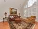 Bright Gathering room with vaulted ceiling, large windows, and comfortable seating at 11756 Easthampton Cir, Charlotte, NC 28277