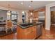Open concept kitchen with island, granite countertops, and stainless steel appliances at 11756 Easthampton Cir, Charlotte, NC 28277