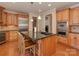 Eat-in kitchen with island, granite countertops, and stainless steel appliances at 11756 Easthampton Cir, Charlotte, NC 28277