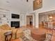 Open living room with fireplace, built-in shelving, and hardwood floors at 11756 Easthampton Cir, Charlotte, NC 28277