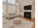 Bright living room with fireplace, large windows, and hardwood floors at 11756 Easthampton Cir, Charlotte, NC 28277