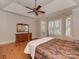 Main bedroom with hardwood floors, a ceiling fan, and an ensuite bathroom at 11756 Easthampton Cir, Charlotte, NC 28277