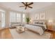 Spacious main bedroom with hardwood floors, large windows, and sitting area at 11756 Easthampton Cir, Charlotte, NC 28277