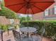Relaxing patio with umbrella, table, and chairs, perfect for outdoor dining at 11756 Easthampton Cir, Charlotte, NC 28277