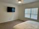 Bedroom with mounted TV and window with blinds at 1194 Great Falls Hwy, Chester, SC 29706