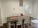 Bright dining room with a rustic farmhouse table and six chairs at 1194 Great Falls Hwy, Chester, SC 29706