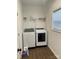 Laundry room with washer, dryer, and overhead shelving at 1194 Great Falls Hwy, Chester, SC 29706