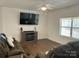Bright living room with hardwood floors, fireplace, and large TV at 1194 Great Falls Hwy, Chester, SC 29706