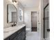 Modern bathroom with a large vanity, walk-in shower, and linen closet at 13311 Arbor Meadows Ct, Charlotte, NC 28269