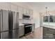 Modern kitchen with stainless steel appliances and an island at 13311 Arbor Meadows Ct, Charlotte, NC 28269