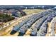 Aerial view of a new residential community featuring modern townhomes near a baseball field at 1419 Newell Towns Ln, Charlotte, NC 28262
