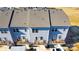 Aerial view of the neighborhood showcasing townhomes with decks and garages at 1419 Newell Towns Ln, Charlotte, NC 28262