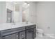 Bathroom features a double vanity sink, mirror, and toilet at 1419 Newell Towns Ln, Charlotte, NC 28262
