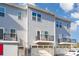 Exterior of gray townhomes featuring private decks and garages at 1419 Newell Towns Ln, Charlotte, NC 28262