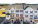 Well-maintained townhome exterior showing a mix of stone and siding with a manicured lawn at 1419 Newell Towns Ln, Charlotte, NC 28262