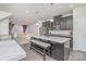Spacious kitchen features a large island with seating, granite countertops, and stainless appliances at 1419 Newell Towns Ln, Charlotte, NC 28262