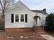 Charming single-story home with brick accents and a welcoming front porch at 1426 Hilltop St, Albemarle, NC 28001